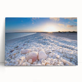 Stretched canvas artwork showcasing a serene seascape design with soft blue and green tones, leaning against a wall, ideal for coastal-themed decor.