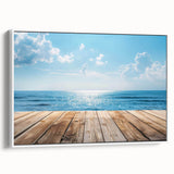 Framed canvas wall art showcasing a serene seascape design with vibrant blues and whites, ideal for coastal home decor, viewed from the side.
