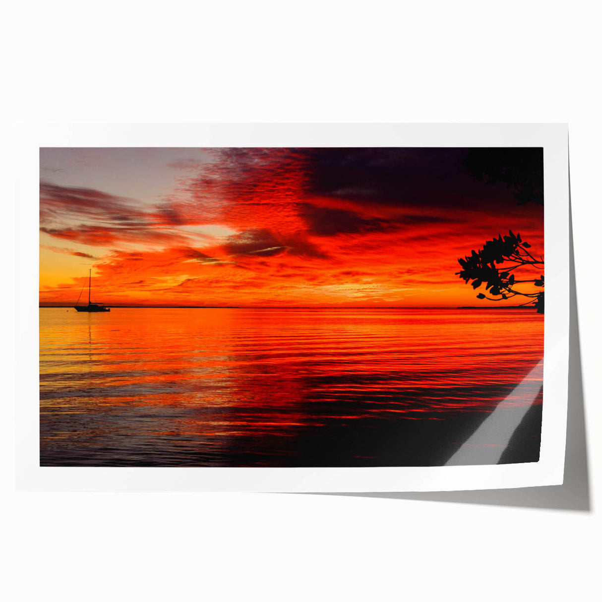 Vibrant seascape wall art print showcasing a serene sunset over calm waters, featuring rich blues and warm oranges, rolled and ready for framing.
