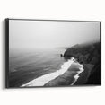 Framed canvas wall art showcasing a serene seascape design with vivid blue and green hues, displayed in a sleek black frame, perfect for coastal home decor.