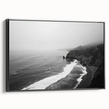 Framed canvas wall art showcasing a serene seascape design with vivid blue and green hues, displayed in a sleek black frame, perfect for coastal home decor.