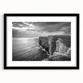 Framed wall art featuring a scenic seascape design in a black frame with a white mat, showcasing vibrant ocean colors and tranquil waves, perfect for home decor.