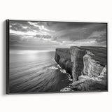 Framed canvas wall art showcasing a serene seascape design with soft blue and green hues, elegantly displayed with a black frame, perfect for coastal home decor.