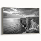 Framed canvas wall art from the Landscapes and Seascapes collection, showcasing serene ocean waves in calming blues and whites, accented with a sleek silver frame.