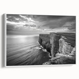 Framed canvas wall art showcasing a serene seascape design, featuring calming blue and white tones, elegantly displayed from the side with a minimalist white frame, ideal for coastal-themed decor.