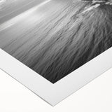 Rolled canvas artwork showcasing a vibrant seascape design, featuring dynamic waves and a sunset palette, ideal for coastal decor enthusiasts.