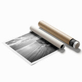 Rolled print of a serene seascape featuring vibrant blues and soft white waves, designed for wall art decor, elegantly packaged in a protective cardboard tube.