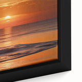 Close-up of a framed canvas artwork showcasing a vibrant seascape design with waves and sunset hues, ideal for home decor and coastal themes.