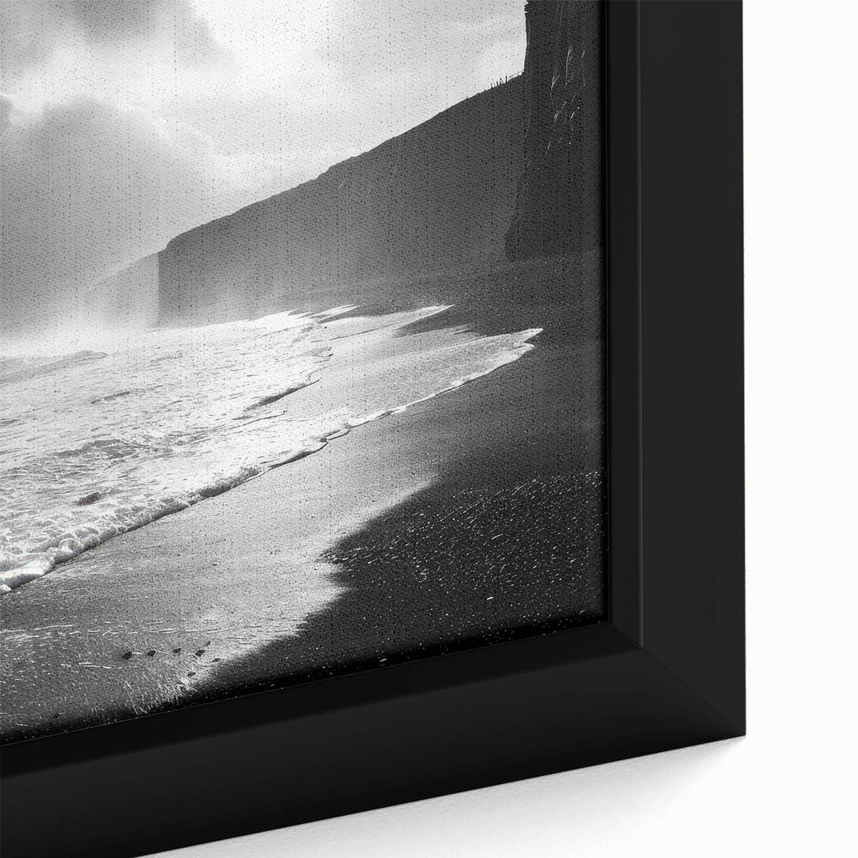 Close-up of a framed canvas wall art piece from the Landscapes & Seascapes collection, showcasing vivid colors and intricate details of ocean waves and sandy beaches, ideal for home decor.