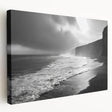 Stretched canvas artwork depicting a vibrant seascape with bold blues and greens, showcasing waves crashing against a rocky shore, ideal for coastal-themed decor.