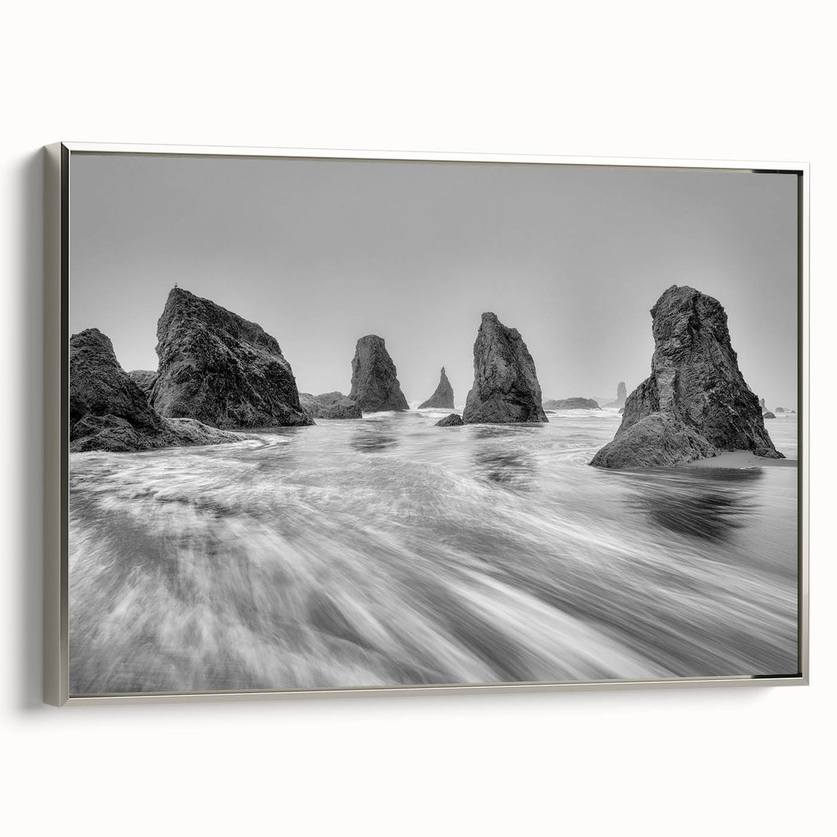 Framed wall art featuring a serene seascape design, showcasing gentle waves and a calming color palette of blues and grays, perfect for coastal decor.