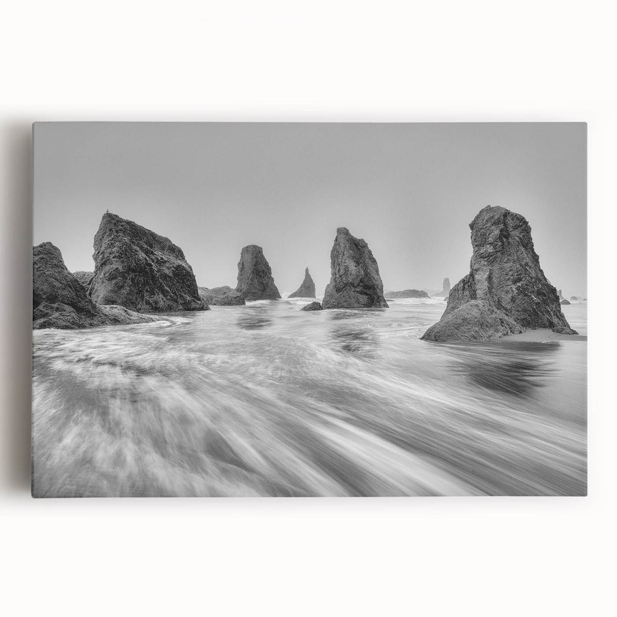 Vibrant stretched canvas wall art showcasing a serene seascape with soft waves and a sunset horizon, perfect for coastal home decor and relaxation.