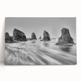 Stretched canvas wall art featuring a serene seascape design with soft blues and greens, elegantly leaning against a neutral wall, perfect for coastal-themed decor.