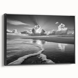 Framed canvas wall art showcasing a serene seascape design, featuring calming blue and white hues, ideal for home decor. The black frame adds elegance to any room.