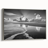 Framed canvas wall art showcasing a serene seascape design with elegant silver accents, positioned at a slight angle to highlight its texture and modern aesthetic. Ideal for coastal-themed decor, this stunning piece enhances any living space with its calming colors and artistic flair.