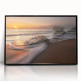 Framed acrylic wall art featuring a serene seascape design with calming blue hues, elegantly displayed against a sleek black frame, ideal for modern home décor.