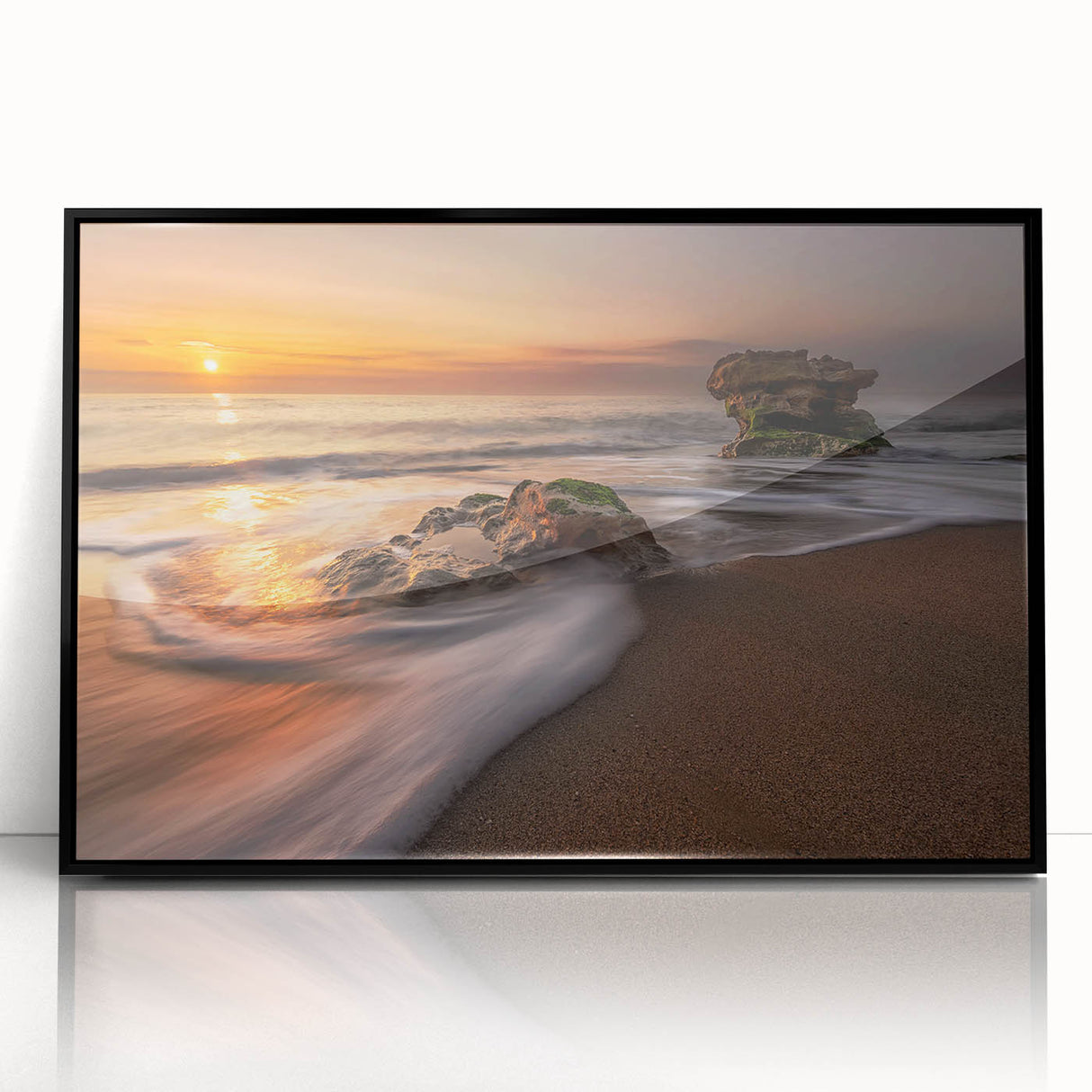 Framed acrylic wall art featuring a serene seascape design with calming blue hues, elegantly displayed against a sleek black frame, ideal for modern home décor.