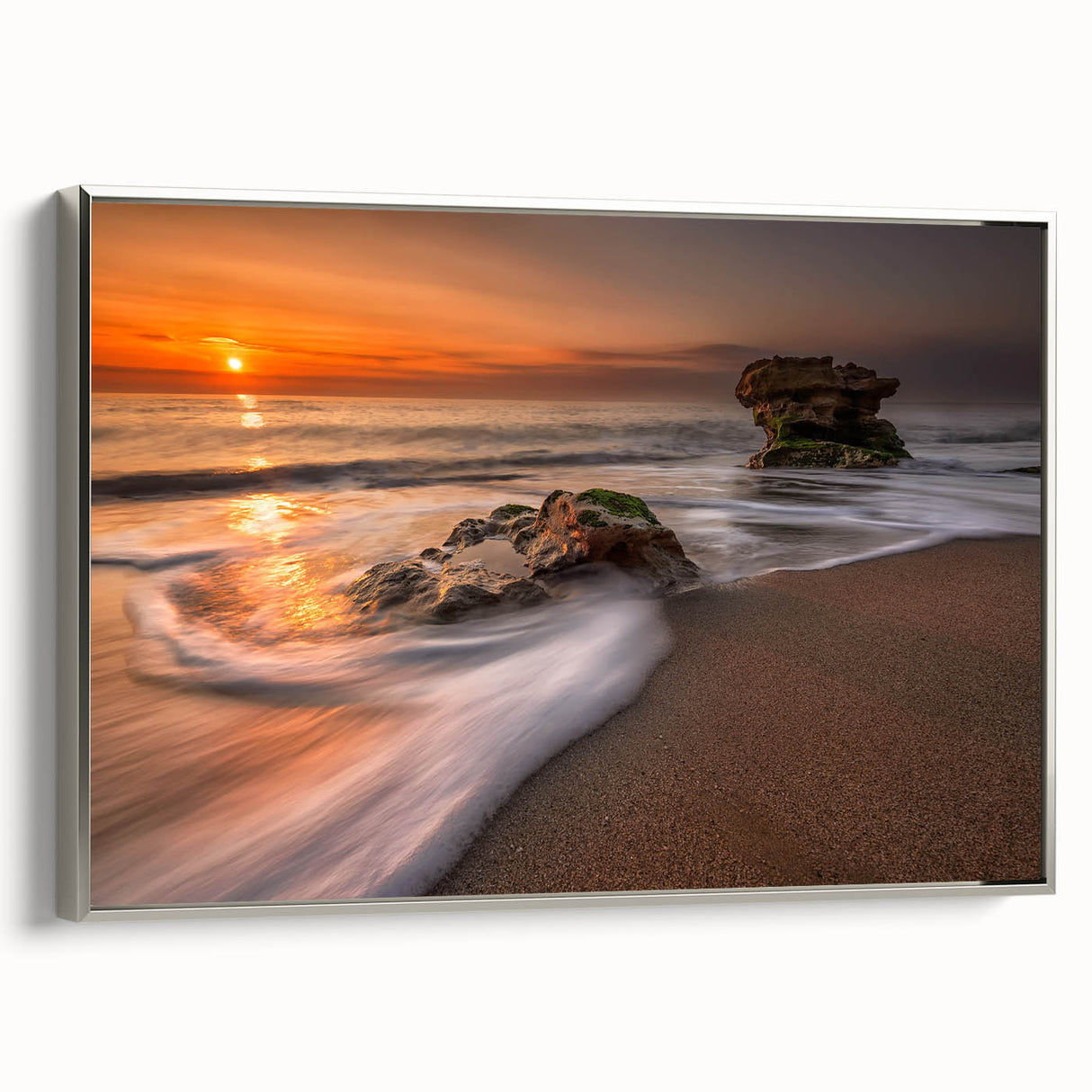 Framed canvas wall art showcasing a serene seascape design with silver accents, highlighting tranquil blue ocean waves and a soft sky, perfect for coastal decor.