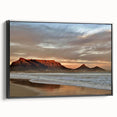 Framed canvas wall art depicting a serene seascape design, featuring vibrant blues and greens, displayed from a black side view, ideal for coastal decor.