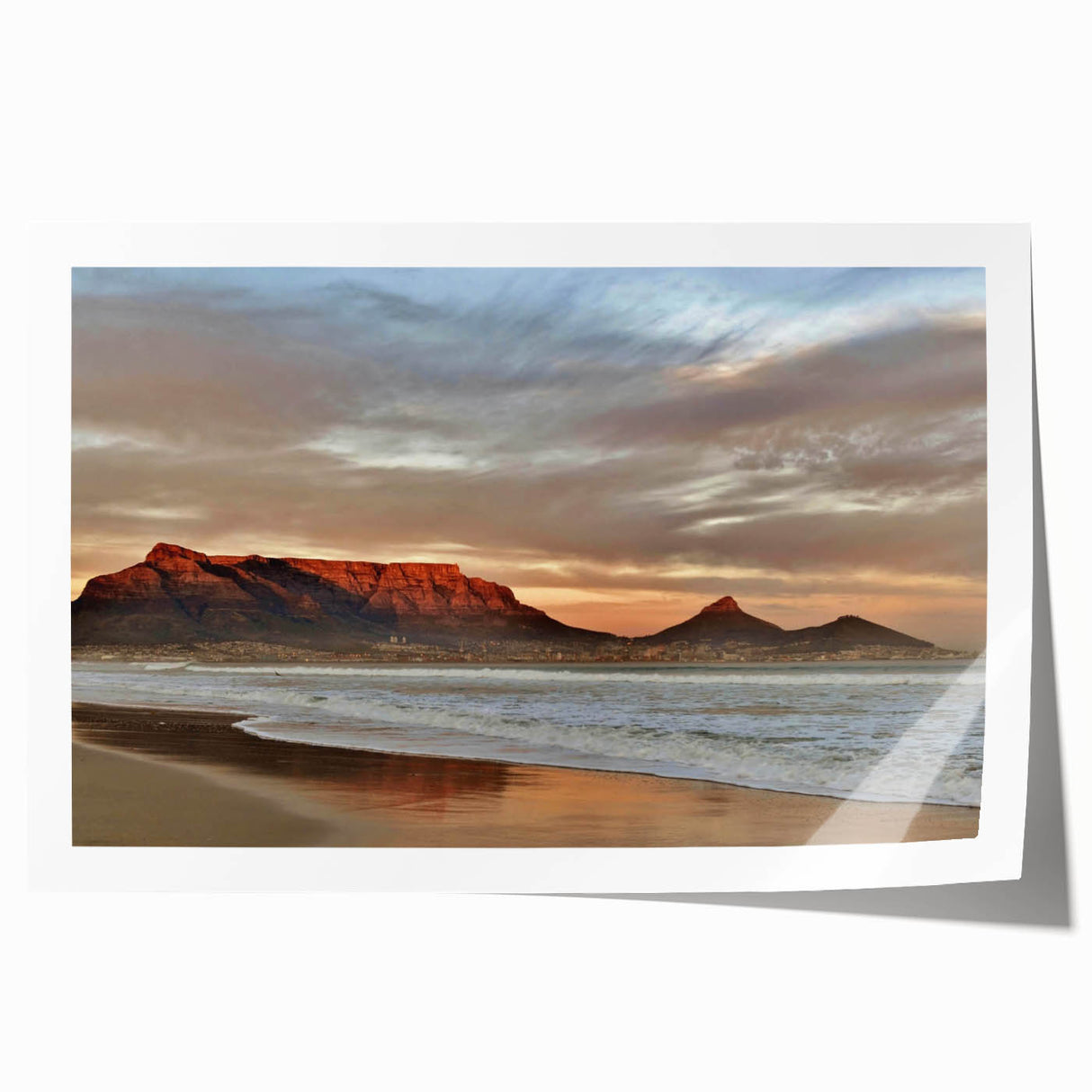 Vibrant rolled print of seascape wall art showcasing serene ocean waves and a colorful sunset, ideal for home decor, packaged securely in a cardboard tube.