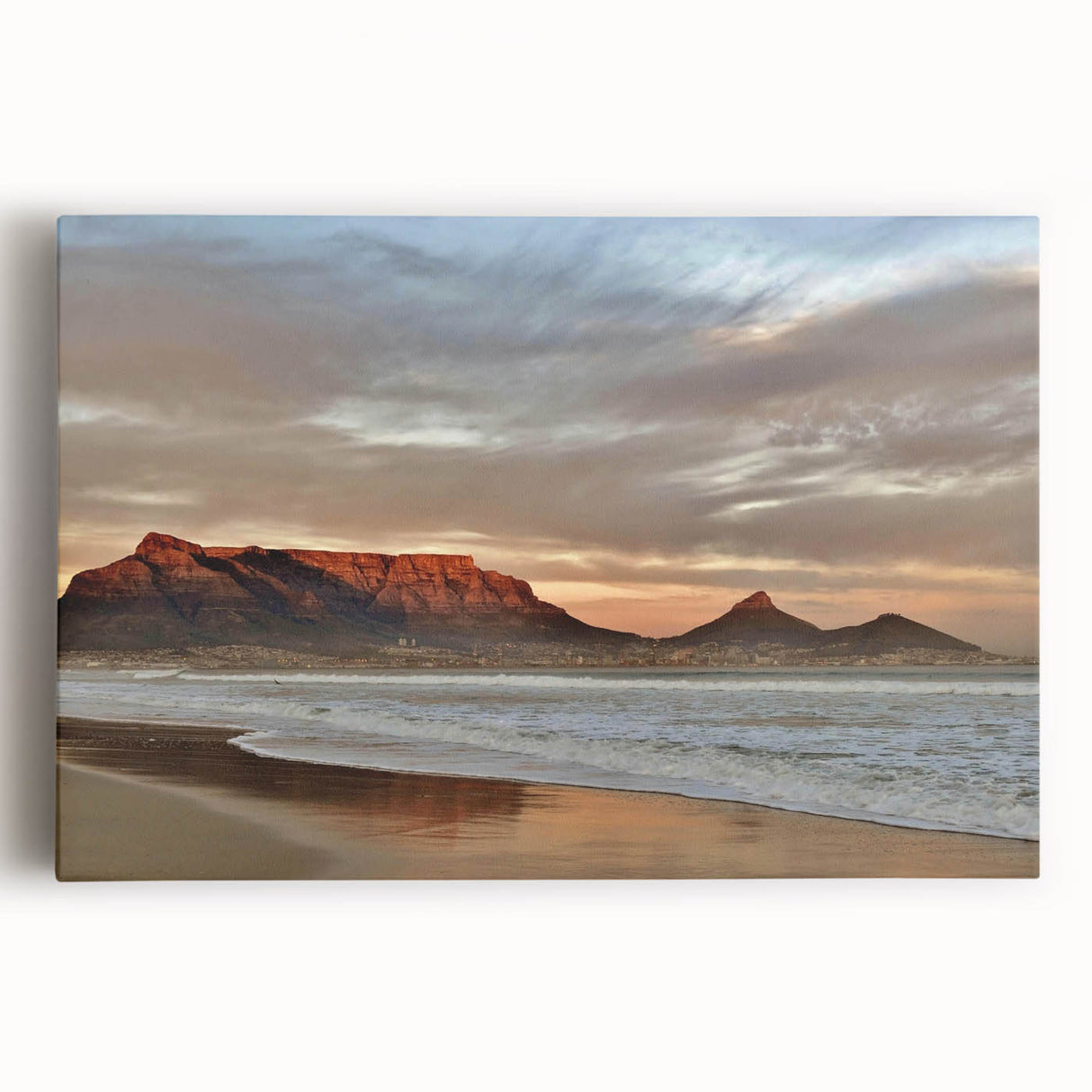 Stretched canvas wall art of a serene seascape design, showcasing vibrant blue ocean waves and a golden sunset, perfect for coastal-themed decor.