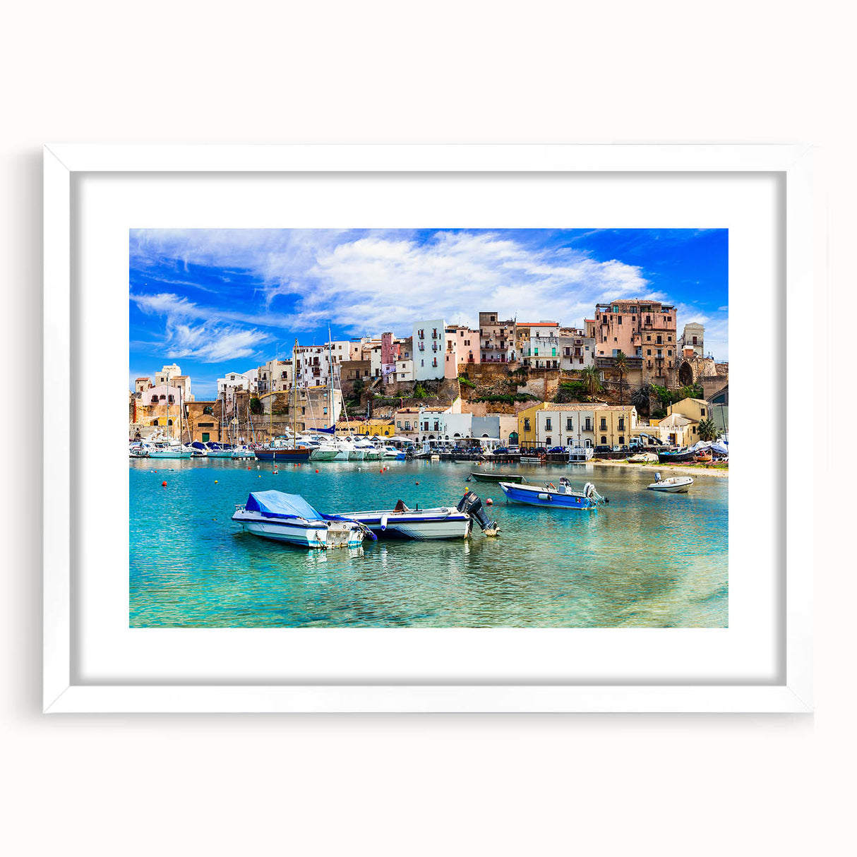 Framed wall art showcasing a serene seascape design with soft blue tones and white matting, perfect for coastal-themed decor, enhancing any living space.