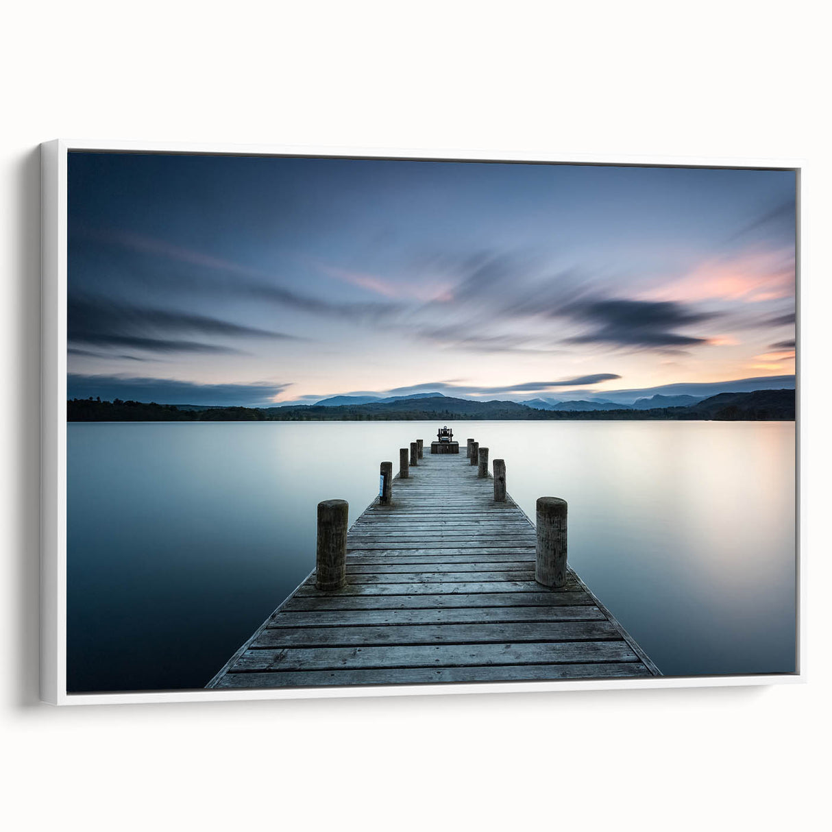 Framed canvas wall art showcasing a serene seascape design with soft blue and white tones, highlighted by a modern white frame, ideal for coastal-themed decor.