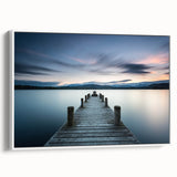 Framed canvas wall art showcasing a serene seascape design with soft blue and white tones, highlighted by a modern white frame, ideal for coastal-themed decor.