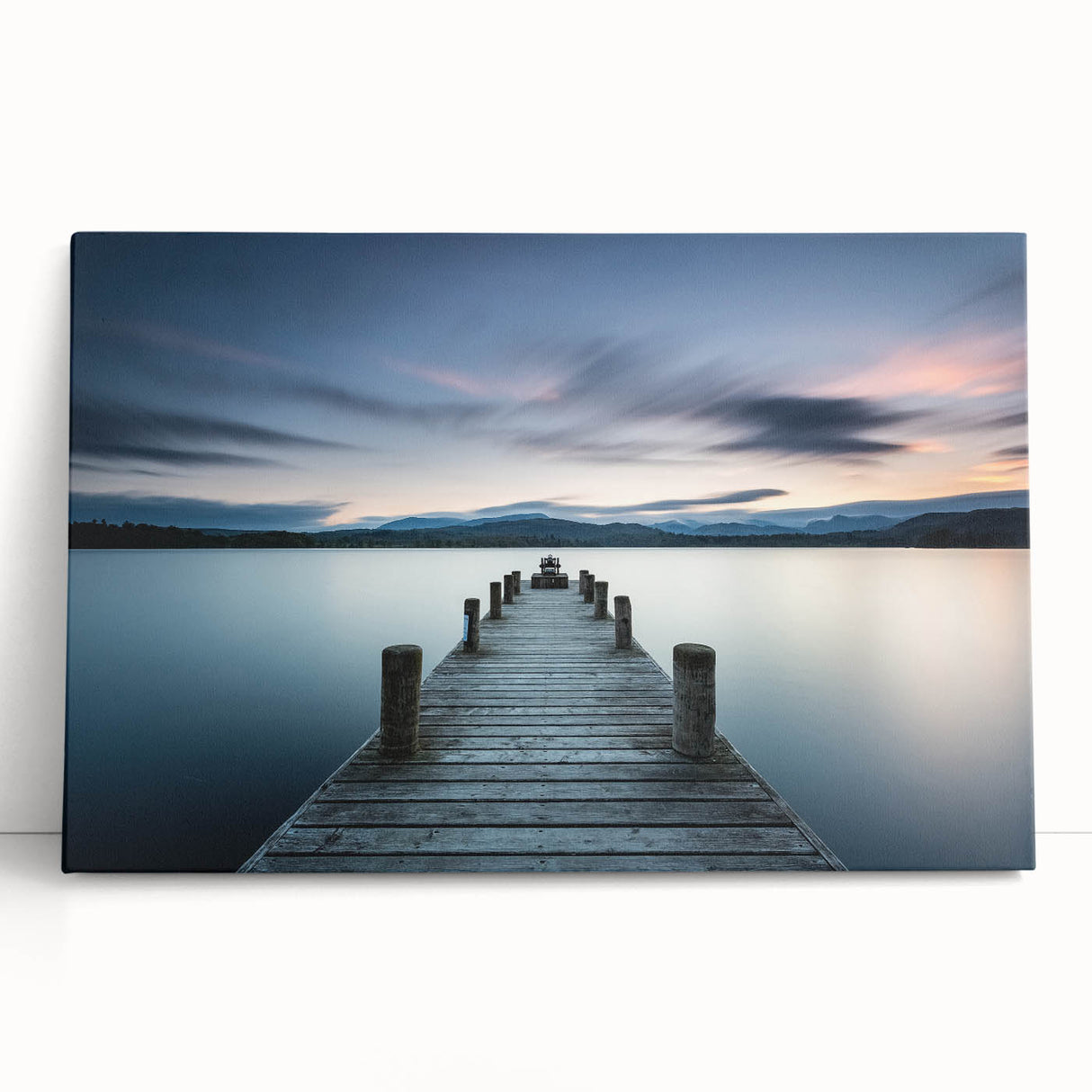 Stretched canvas wall art featuring a serene seascape design, showcasing gentle waves and a vibrant sunset with hues of orange and blue, perfect for coastal decor.