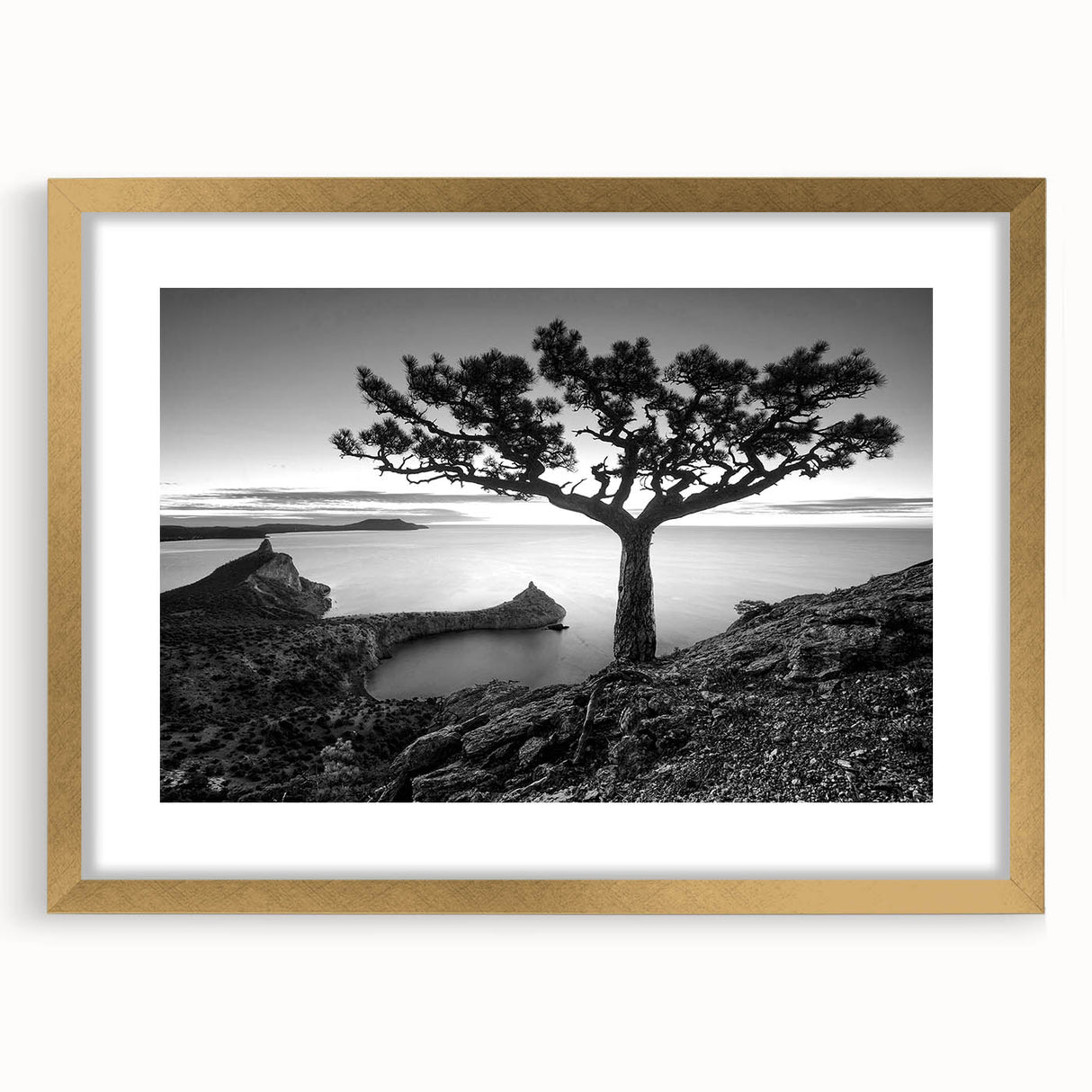 Elegant gold-framed wall art showcasing a serene seascape with soft waves and a vibrant sunset, ideal for enhancing home decor and creating a calming atmosphere.