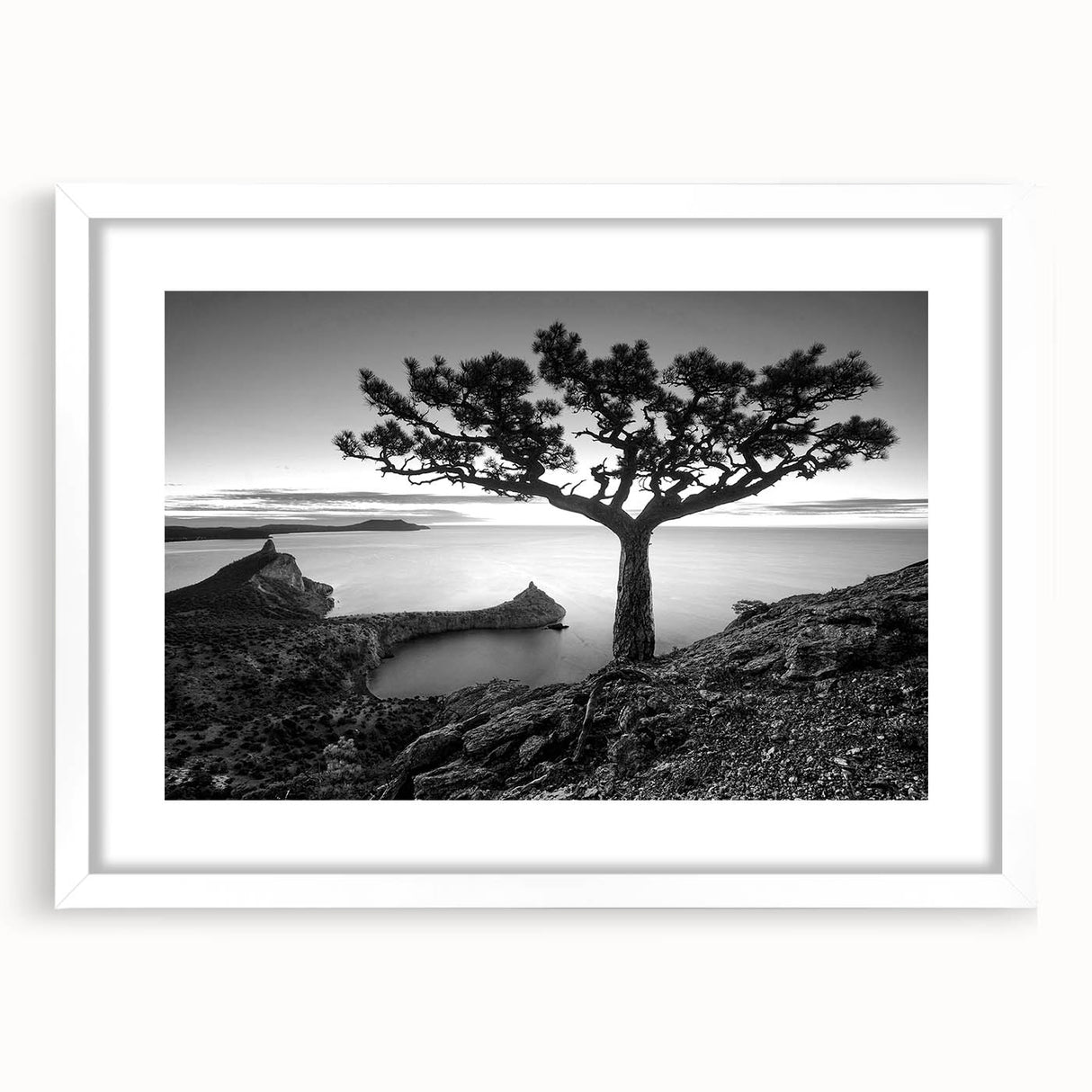 Framed wall art featuring a serene seascape design with vibrant blues and soft whites, elegantly matted and set in a sleek white frame, perfect for coastal decor.