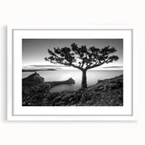 Framed wall art featuring a serene seascape design with vibrant blues and soft whites, elegantly matted and set in a sleek white frame, perfect for coastal decor.