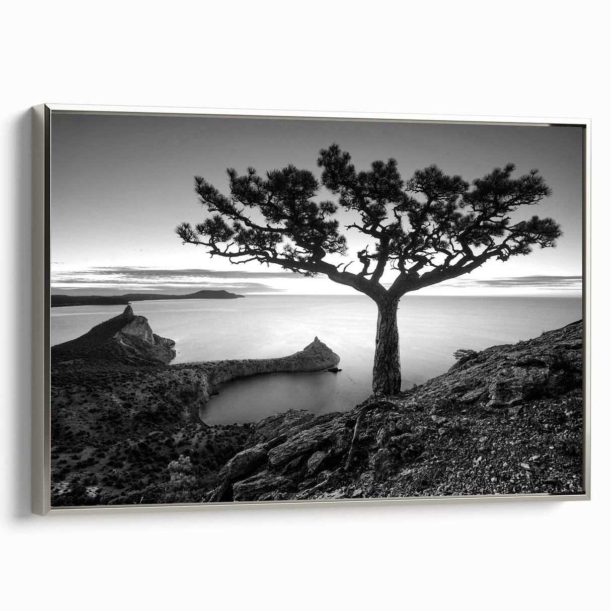 Framed canvas wall art showcasing a serene seascape design with silver accents, ideal for modern home decor, enhancing living spaces with tranquil ocean views.