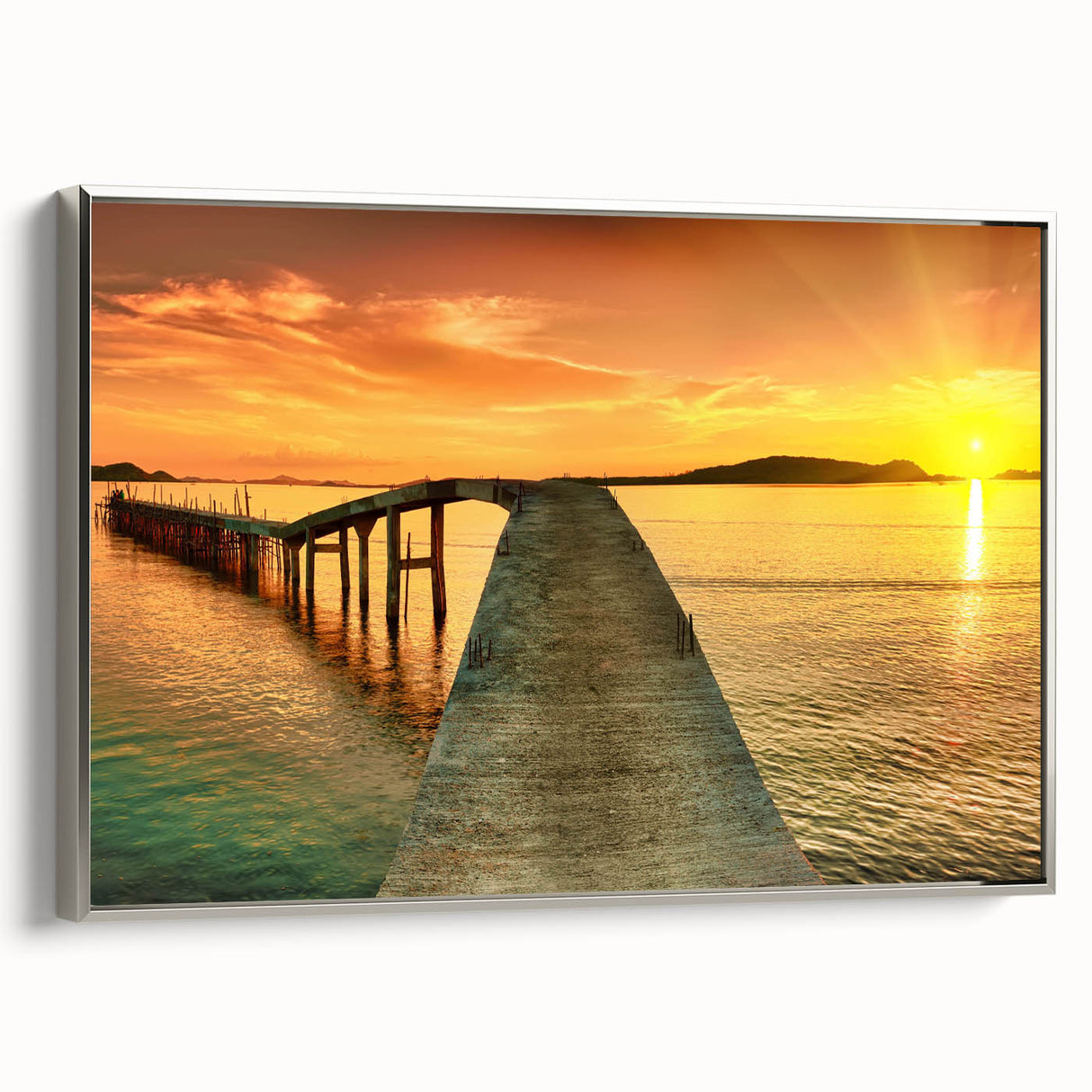 Framed canvas wall art showcasing a serene seascape with calming blue and gray tones, elegantly displayed with a sleek silver frame, perfect for coastal home decor.
