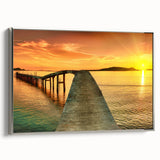 Framed canvas wall art showcasing a serene seascape with calming blue and gray tones, elegantly displayed with a sleek silver frame, perfect for coastal home decor.