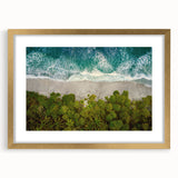Elegant gold-framed wall art featuring a serene coastal landscape, showcasing vibrant blue ocean waves and soft sandy beaches, perfect for home decor.