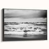 Framed canvas wall art showcasing a coastal landscape design with rich blue and green hues, elegantly presented with a black frame, perfect for modern decor.