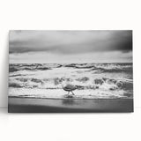 Stretched canvas wall art collection showcasing vibrant landscapes and seascapes, elegantly leaning against a neutral wall, perfect for enhancing home decor.