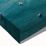 Close-up of a vibrant seascape canvas wall art featuring rich blue and green hues, ideal for coastal-themed decor, showcasing waves and serene ocean views.