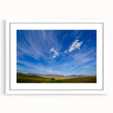 Framed landscape wall art collection showcasing vibrant skyscapes, set in a sleek white frame with matting, perfect for modern home decor.