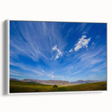 Framed canvas wall art showcasing a serene landscape design with soft blue and white hues, displayed in a stylish white frame, ideal for modern home decor.