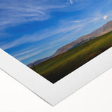 Vibrant rolled canvas wall art depicting a stunning landscape scene with colorful skies, ideal for home decor, and securely packaged in a protective tube.