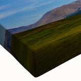 Close-up of a stretched canvas featuring a vibrant landscapes and skyscapes design, showcasing rich colors and intricate details, perfect for modern home decor.