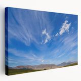 Stretched canvas wall art showcasing a vibrant landscape with stunning skyscapes, featuring rich colors and intricate details, perfect for home decor enhancement.