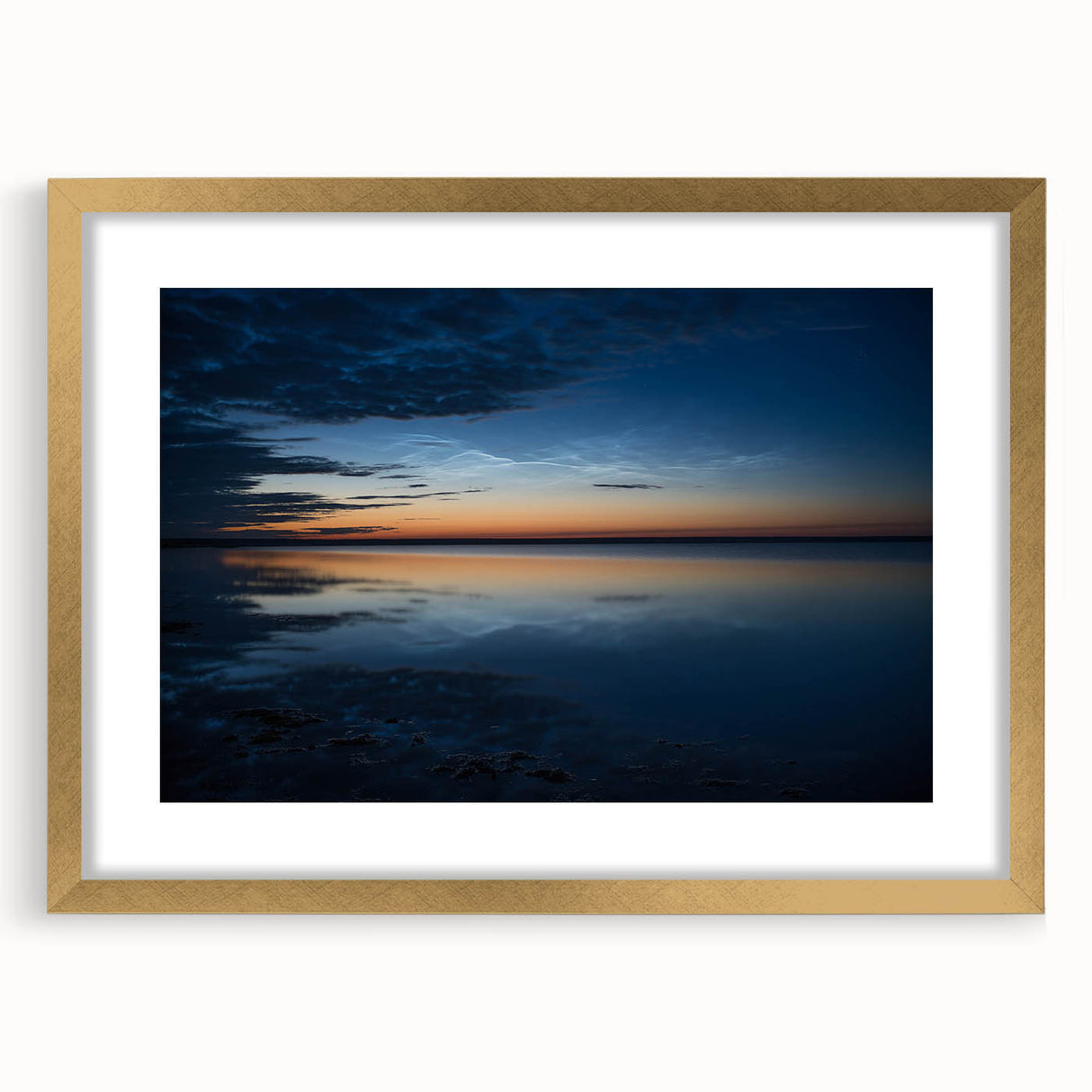 Framed landscape wall art collection featuring serene skyscapes in gold matting, ideal for enhancing home decor with artistic elegance and tranquility.