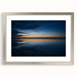 Framed wall art collection showcasing a serene landscape with soft blue and green tones, featuring a silver frame and mat for an elegant presentation, ideal for home decor.