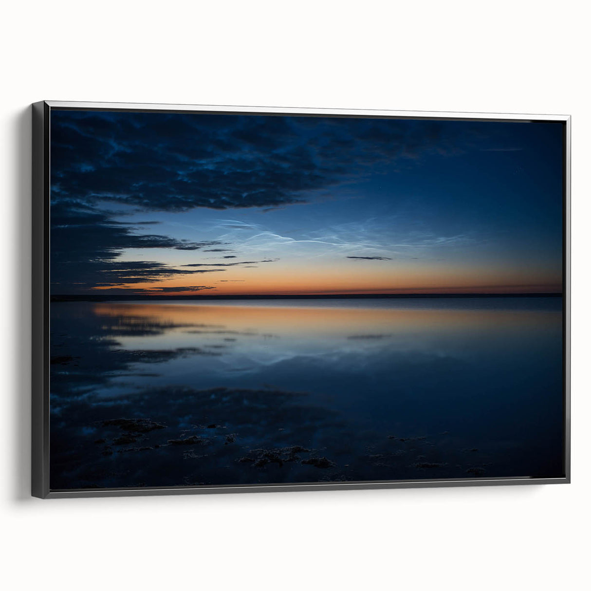 Framed canvas wall art showcasing a vibrant landscape with dramatic skyscapes, featuring rich colors and textures, presented in a sleek black frame, ideal for home decor.