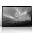 Framed acrylic wall art featuring a serene landscape with soft blue skies and lush greenery, set in a sleek black frame, ideal for modern home decor.