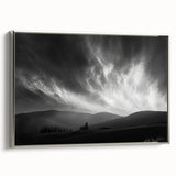 Framed canvas wall art showcasing a serene landscape with soft hues of blue and green, featuring a silver frame that enhances its modern aesthetic, perfect for home decor.