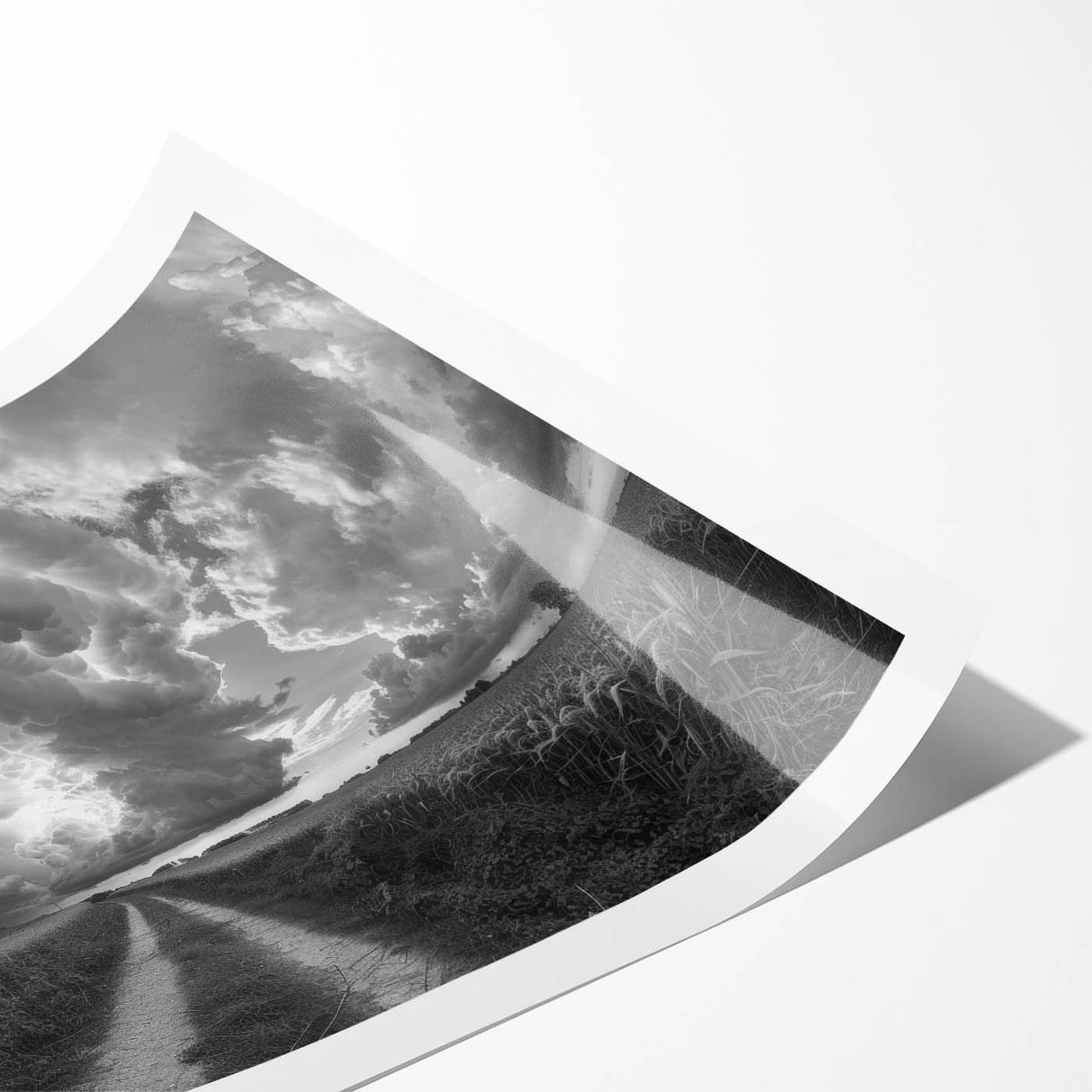 Rolled print showcasing a serene landscape with vibrant colors and soft clouds, ideal for home decor or office use, presented in a protective cardboard tube.